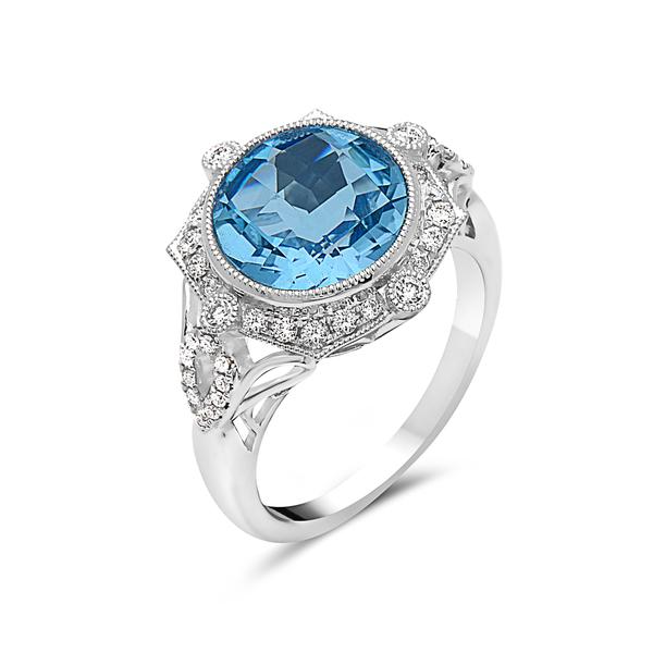 View 14Kw or y/14kr Gold Blue Topaz Ring